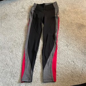 Never worn lululemon leggings with gray and red side detail